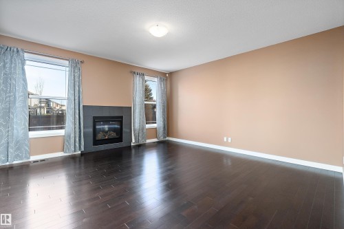103 Rosemount Bay, Beaumont, AB - Indoor Photo Showing Living Room With Fireplace