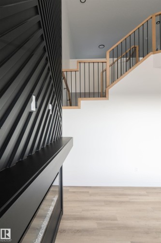 Stairs featuring wood finished floors - 163 Starling Way, Fort Saskatchewan, AB - Indoor Photo Showing Other Room