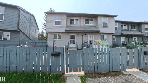 View of front of house featuring a fenced front yard and a gate - 3122 142 Avenue, Edmonton, AB - Outdoor With Facade