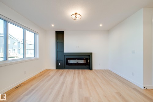 18 Blackbird Bend, Fort Saskatchewan, AB - Indoor Photo Showing Living Room With Fireplace