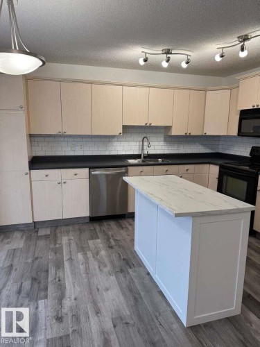 23 Vernon, Spruce Grove, AB - Indoor Photo Showing Kitchen With Double Sink