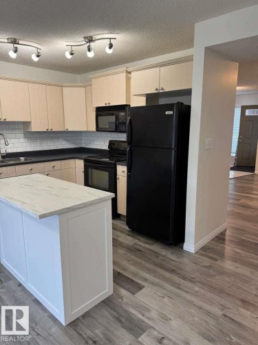 23 Vernon, Spruce Grove, AB - Indoor Photo Showing Kitchen With Double Sink