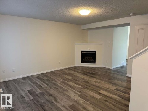 23 Vernon, Spruce Grove, AB - Indoor Photo Showing Living Room With Fireplace
