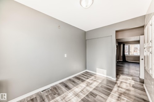 Unfurnished room featuring light wood finished floors - 8639 64 Avenue Nw, Edmonton, AB - Indoor Photo Showing Other Room