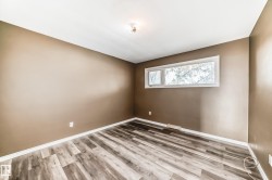 Empty room featuring light wood finished floors - 