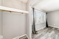 Spare room with light wood-style floors and baseboards - 