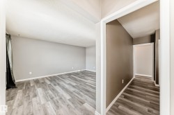 Hallway featuring wood finished floors - 
