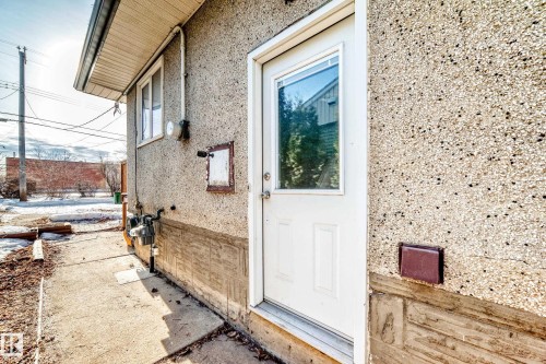 View of exterior entry with stucco siding - 8639 64 Avenue Nw, Edmonton, AB - Outdoor