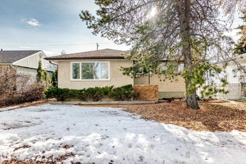View of front facade with stucco siding and a shingled roof - 8639 64 Avenue Nw, Edmonton, AB - Outdoor
