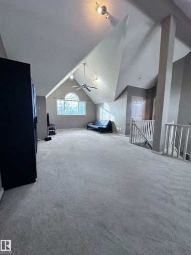 Bonus room featuring carpet flooring and ceiling fan - 23 4821 Terwillegar Common, Edmonton, AB - Indoor Photo Showing Other Room