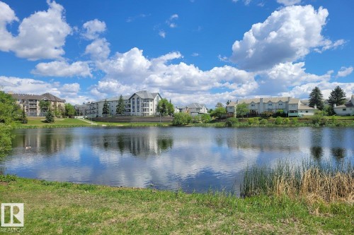 The property is situated by a body of water, offering scenic water views - 237 17447 98A Avenue, Edmonton, AB - Outdoor With Body Of Water With View