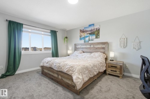 Carpeted bedroom with baseboards - 48 Douglas Crescent, Leduc, AB - Indoor Photo Showing Bedroom