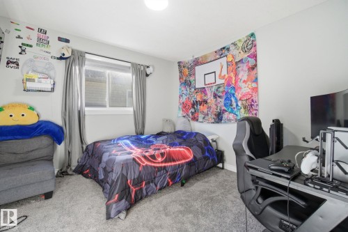Bedroom featuring carpet floors and an office area - 48 Douglas Crescent, Leduc, AB - Indoor Photo Showing Bedroom