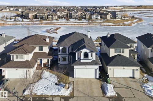 Snowy aerial view with a residential view - 48 Douglas Crescent, Leduc, AB - Outdoor With Facade