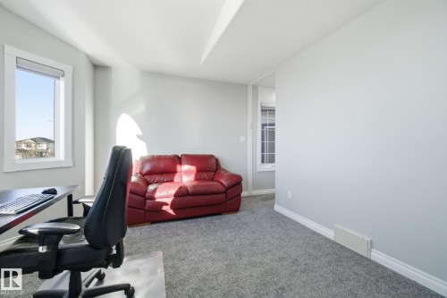 Carpeted home office featuring baseboards - 48 Douglas Crescent, Leduc, AB - Indoor