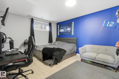 Bedroom featuring wood finished floors - 48 Douglas Crescent, Leduc, AB - Indoor