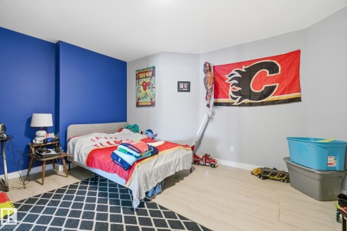 Bedroom with light wood-type flooring and baseboards - 48 Douglas Crescent, Leduc, AB - Indoor Photo Showing Bedroom