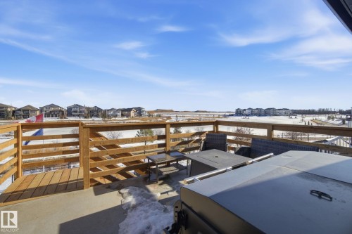 Snow covered patio featuring a residential view, an outdoor lounge area, and a patio area - 48 Douglas Crescent, Leduc, AB - Outdoor With View