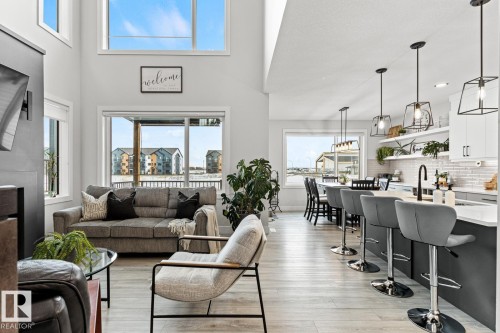 Living area with LVP flooring, south facing windows and custom window coverings. - 5 Starling, Fort Saskatchewan, AB 