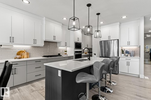 Two tone kitchen featuring stainless steel appliances - 5 Starling, Fort Saskatchewan, AB 
