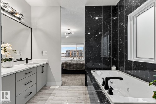 Gorgeous ensuite with jetted soaker tub with tile surround and dual sinks. - 5 Starling, Fort Saskatchewan, AB 