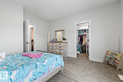 Bedroom with a spacious walk in closet with natural light. - 5 Starling, Fort Saskatchewan, AB 