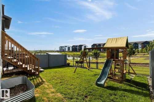 Fenced yard with a view of park and pond. - 5 Starling, Fort Saskatchewan, AB 