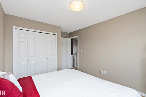 Bedroom with a closet - 33 Sutherland Street, Leduc, AB - Indoor Photo Showing Bedroom