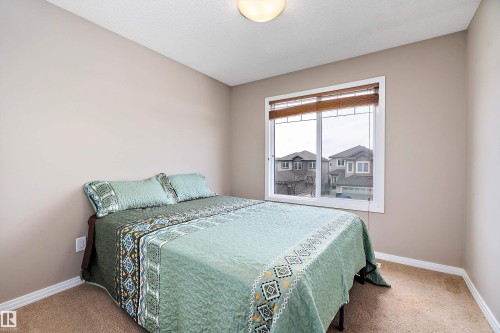 Bedroom featuring carpet - 33 Sutherland Street, Leduc, AB - Indoor Photo Showing Bedroom