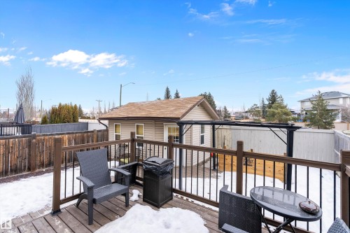 Wooden deck with an outbuilding - 33 Sutherland Street, Leduc, AB - Outdoor With Deck Patio Veranda With Exterior