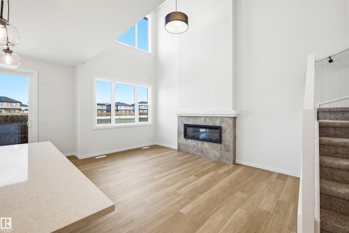 5107 69 Street, Beaumont, AB - Indoor Photo Showing Living Room With Fireplace