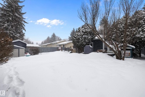 Snowy yard featuring a storage shed - 12 Beacon Crescent, St. Albert, AB - Outdoor