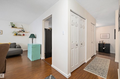Hallway with dark wood finished floors - 12 Beacon Crescent, St. Albert, AB - Indoor Photo Showing Other Room