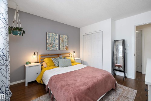 Bedroom featuring dark wood finished floors, a closet, and a textured ceiling - 12 Beacon Crescent, St. Albert, AB - Indoor Photo Showing Bedroom