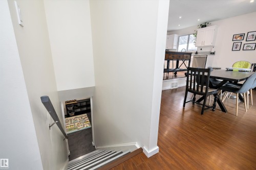 Dining area with dark wood-type flooring and recessed lighting - 12 Beacon Crescent, St. Albert, AB - Indoor Photo Showing Dining Room
