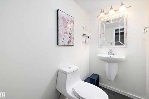 Half bath with toilet and baseboards - 12 Beacon Crescent, St. Albert, AB - Indoor Photo Showing Bathroom