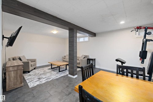 Dining area with recessed lighting, ornamental molding, and beam ceiling - 12 Beacon Crescent, St. Albert, AB - Indoor