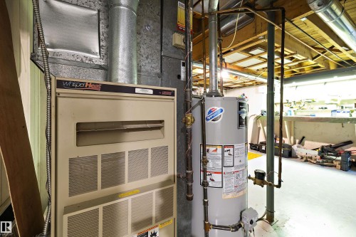 Utilities featuring heating unit and gas water heater - 12 Beacon Crescent, St. Albert, AB - Indoor Photo Showing Basement