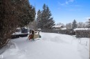 View of yard layered in snow - 12 Beacon Crescent, St. Albert, AB  - Outdoor 