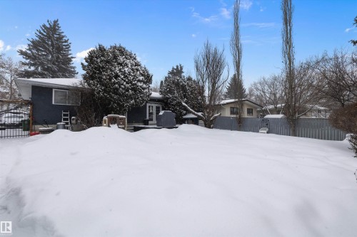 Yard covered in snow featuring a gate - 12 Beacon Crescent, St. Albert, AB - Outdoor