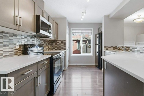 74 3305 Orchards Li, Edmonton, AB - Indoor Photo Showing Kitchen With Upgraded Kitchen