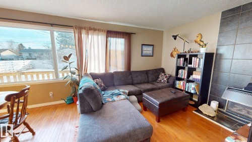 4329 45 Avenue, Drayton Valley, AB - Indoor Photo Showing Living Room With Fireplace