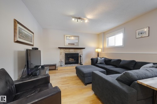18316 60 Avenue, Edmonton, AB - Indoor Photo Showing Living Room With Fireplace