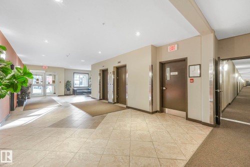 Community lobby featuring recessed lighting - 122 304 Ambleside Link Link, Edmonton, AB - Indoor Photo Showing Other Room