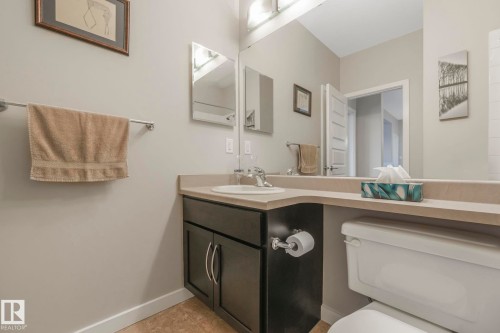 Bathroom featuring vanity and toilet - 122 304 Ambleside Link Link, Edmonton, AB - Indoor Photo Showing Bathroom