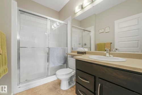 Bathroom with vanity and a shower stall - 122 304 Ambleside Link Link, Edmonton, AB - Indoor Photo Showing Bathroom