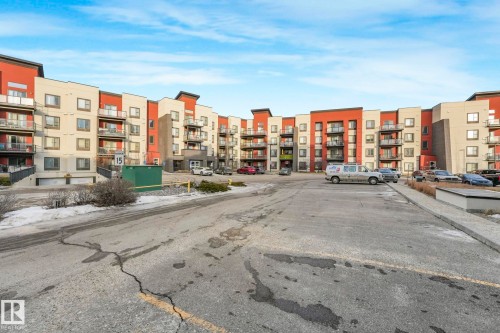 View of apartment building / complex with uncovered parking - 122 304 Ambleside Link Link, Edmonton, AB - Outdoor With Facade