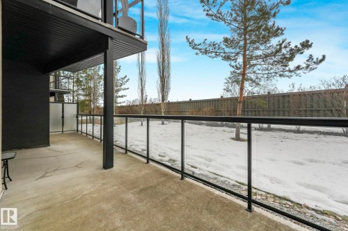 View of snow covered back of property - 122 304 Ambleside Link Link, Edmonton, AB - Outdoor