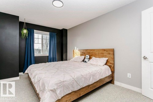 Bedroom with carpet and a textured ceiling - 1381 Rutherford Road, Edmonton, AB - Indoor Photo Showing Bedroom