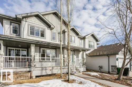 Craftsman-style home featuring a porch and board and batten siding - 1381 Rutherford Road, Edmonton, AB - Outdoor